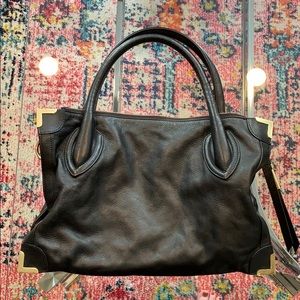 Foley + Corrina black and gold leather handbag